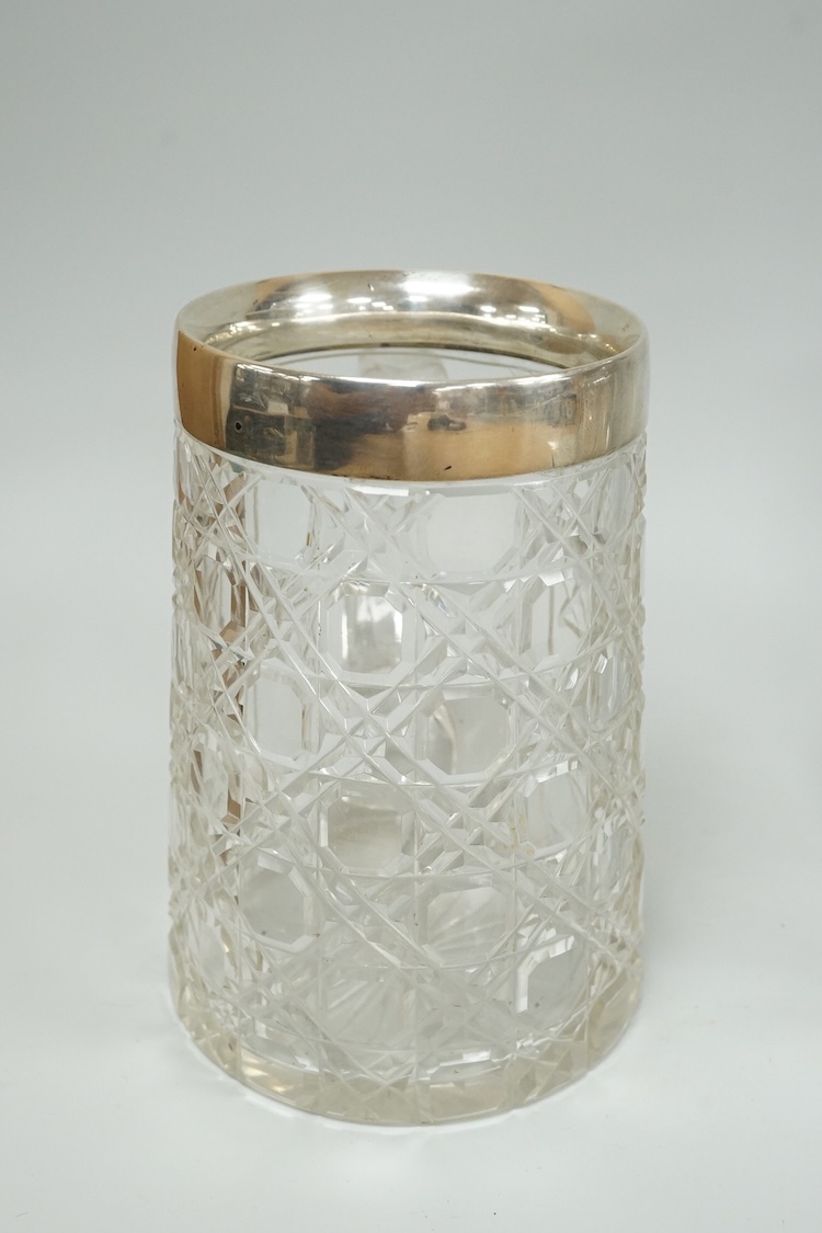 A late Victorian silver mounted cut glass mug, Saunders & Shepherd, Chester, 1899, height 13.4cm, together with a modern silver mounted cut glass decanter and a modern pair of silver 'Whisky' and 'Brandy' wine labels, J.
